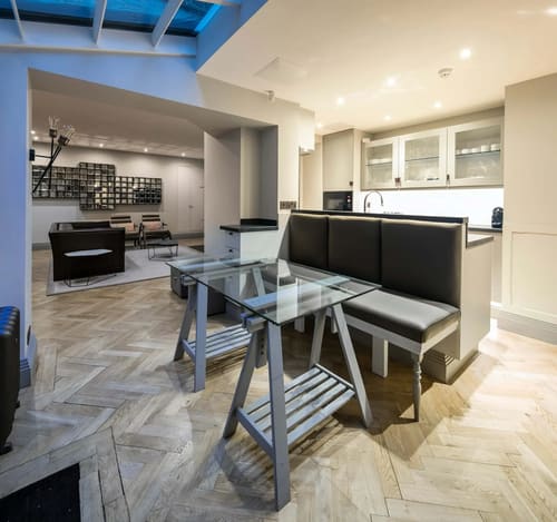 Prime Mayfair 1 bedroom no.3, W1K, Mayfair: Glass dining table with banquette seating