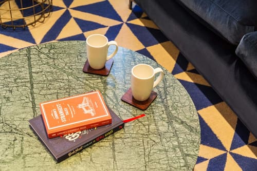 The Bankside Apartments, East London: Coffee cups on a map-print table