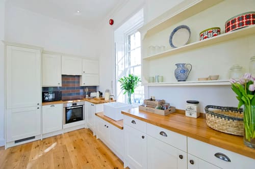 Craven House, Hampton Court: Country-style kitchen with wooden worktops