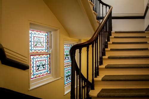 The Leicester Square Apartments, West End: Staircase with stained-glass windows