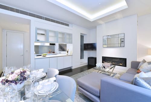 Green Street, W1K, Mayfair: Open-plan living room with kitchen and fireplace