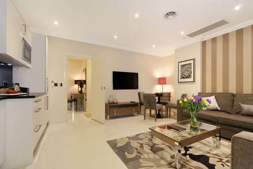 Ashburn Court, Kensington, Kensington: Open-plan living and dining room with wall-mounted TV