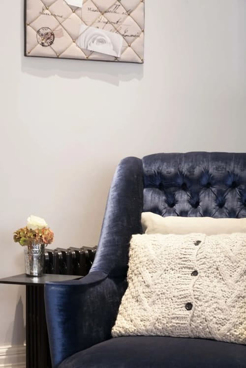 Prime Mayfair 1 bedroom no.1, W1K, Mayfair: Navy buttoned armchair with knitted cushion