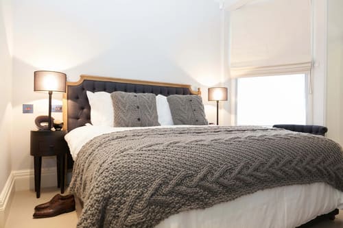 Prime Mayfair 1 bedroom no.2, W1K, Mayfair: Bed with chunky knitted throw
