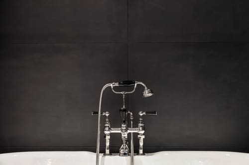 Prime Mayfair 1 bedroom no.2, W1K, Mayfair: Bath taps against a dark tiled wall