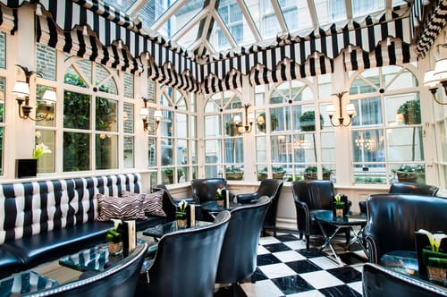 The Milestone Residences, Kensington: Conservatory with striped awning and chequered floor