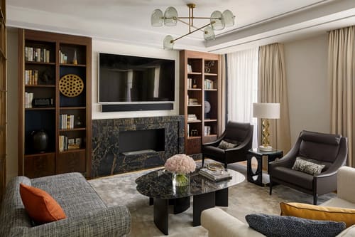 Ten Trinity, City of London: Living room with fireplace and built-in bookcases