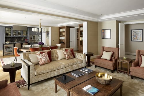 Ten Trinity, City of London: Living room with patterned sofa and armchairs