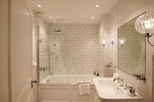 The Capital Apartments, Knightsbridge: Bathroom with bath, shower and metro tiles
