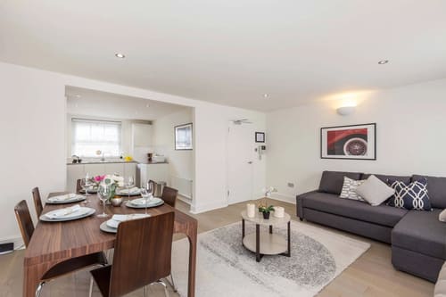 Floral Street Apartments, Covent Garden: Open-plan living and dining room with grey sofa