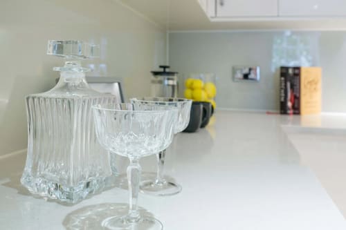 Queens Gate Chic, Kensington: Crystal glasses on a white worktop