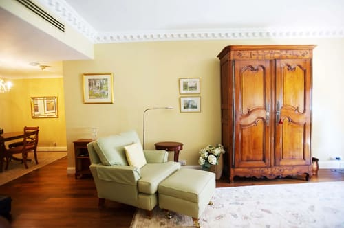 Hertford Street Residences, Mayfair: Sitting room with armchair, footstool and antique wardrobe