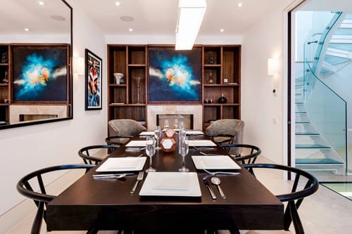 3-bedroom house near High St Kensington, Kensington: Dining table set for six beneath a painting