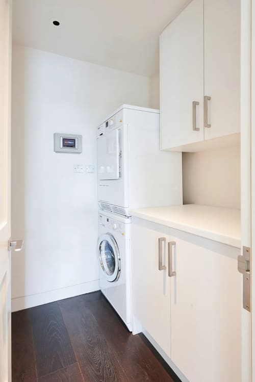 Duke St, W1K, Mayfair: Washer-dryer in a utility cupboard