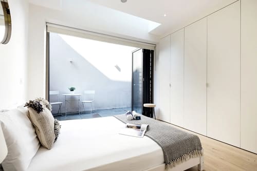 Fitzrovia 2 bedroom near Oxford Street, Fitzrovia: Bedroom opening onto a small terrace