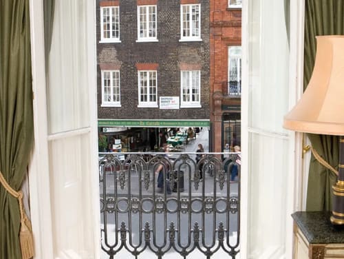 The Curzon Street Apartments, Mayfair: Street view through a balcony railing