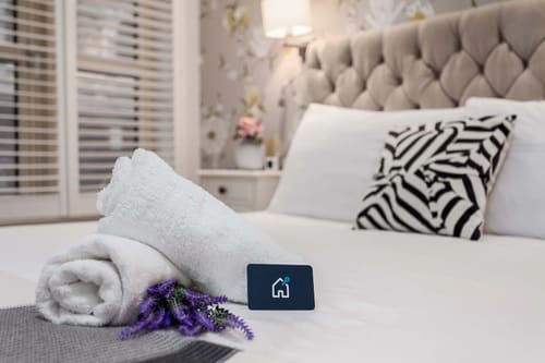 Covent Garden 2 bedroom near Opera House, Covent Garden: Rolled towels and lavender on a bed