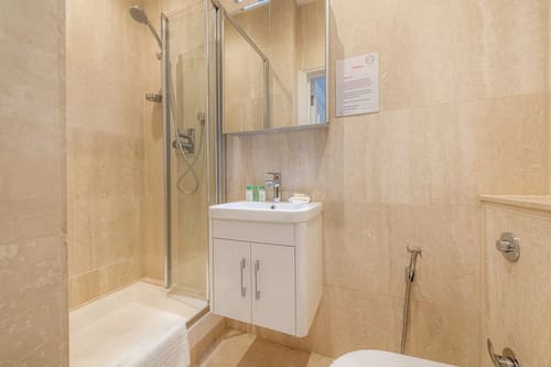 Hertford Street, Mayfair: Shower room with wall-hung basin