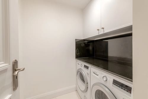 The Fenchurch Street Apartments, East London: Utility room with washing machine and dryer