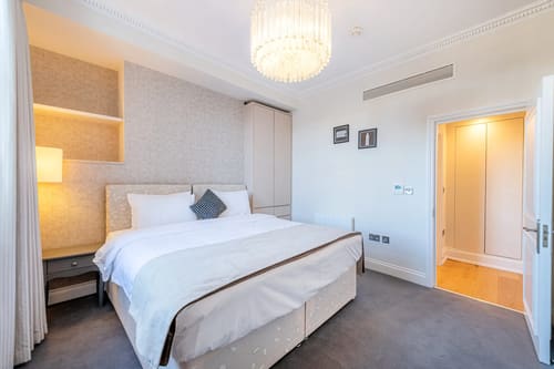 The Fenchurch Street Apartments, East London: Double bedroom with chandelier