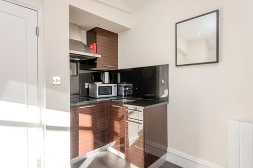 Hertford Street, Mayfair: Compact kitchen with microwave and hob