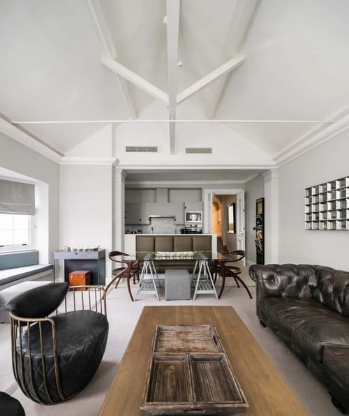 The North Audley Apartments, Mayfair: Dining area with open kitchen under a vaulted ceiling