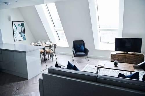 The Shoreditch Warehouse Apartments, East London: Living area under sloping ceilings with skylights