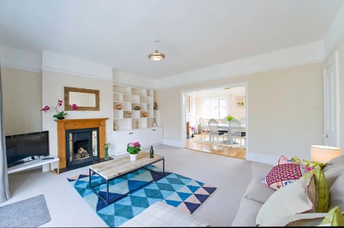 The Claygate Apartments, Claygate: Living room with fireplace and geometric rug