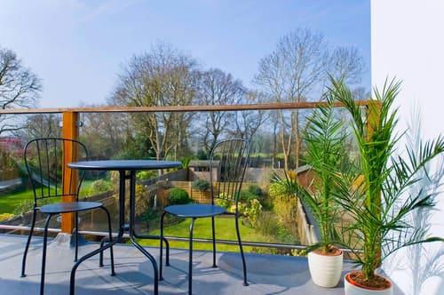 The Claygate Apartments, Claygate: Balcony with bistro table overlooking gardens