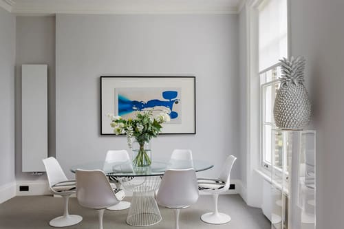 The Little Boltons Apartment, Chelsea: Glass dining table with blue artwork