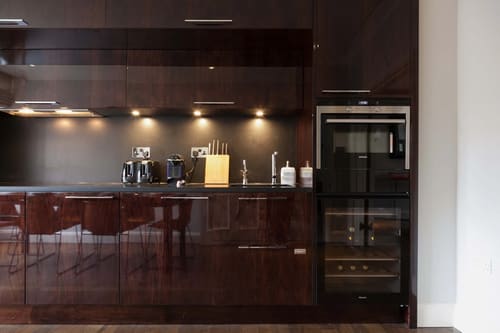 Prime Mayfair 2 bedroom, Mayfair: Kitchen with dark gloss units and wine fridge