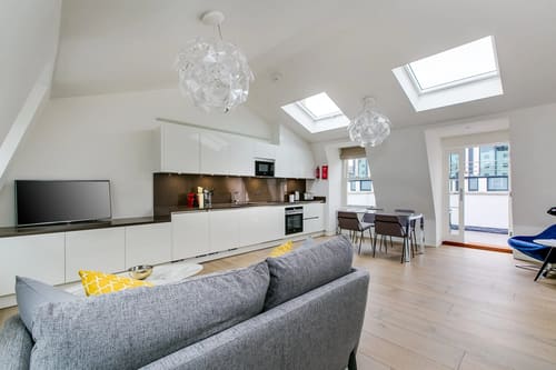 Marylebone Lane Residences, Marylebone: Open-plan kitchen and living room with skylights