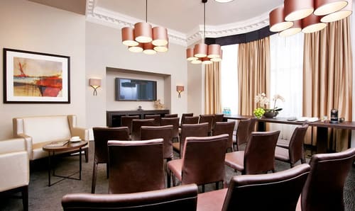 Queens Gate Gardens, Kensington: Meeting room with long table and copper pendant lights