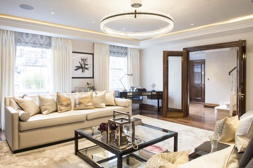 Grosvenor Hill, W1K, Mayfair: Living room with ring chandelier and double doors