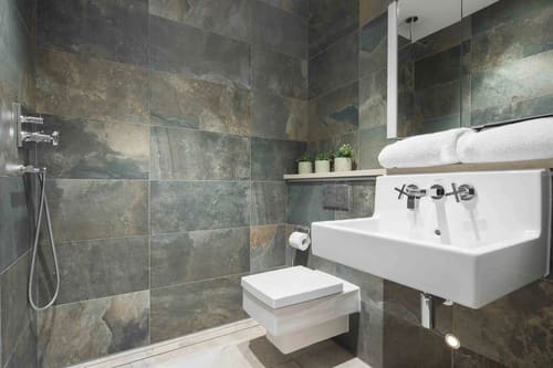 Dean St, Soho (2 bedroom Apartment), West End: Shower room with dark slate tiles