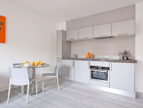 Templeton Place, Earl's Court: Kitchen with grey units and small dining table