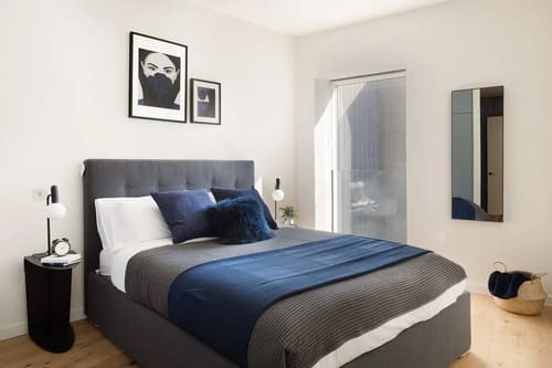 Ewer Street Apartments, Waterloo: Double bed with navy throw