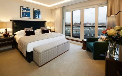Gloucester Park, Kensington: Bedroom with city views through full-height windows
