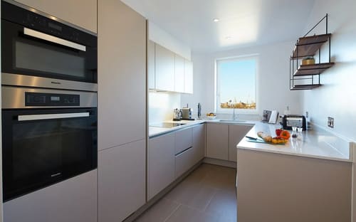 Gloucester Park, Kensington: Kitchen with pale units and city view