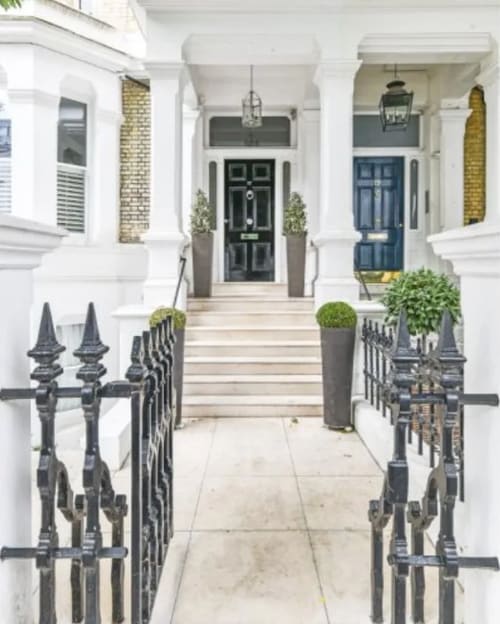 The Little Boltons Apartment, Chelsea: Front steps and black door with columned porch
