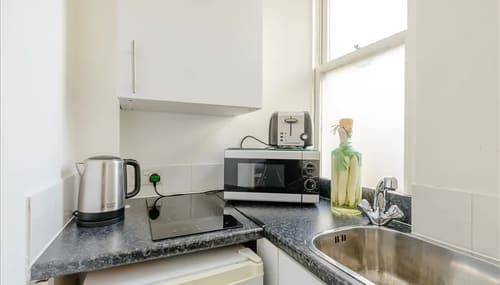 Hill St, W1K, Mayfair: Kitchenette with microwave and kettle