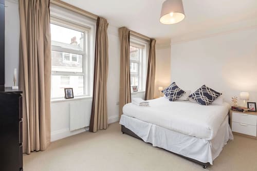 Picton Place, Mayfair: Double bedroom with long curtains