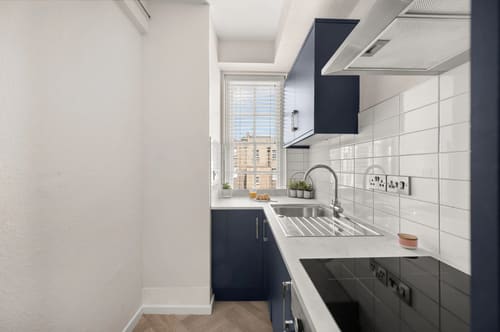 Dolphin House and Dolphin Square Apartments, Pimlico: Galley kitchen with navy units and window