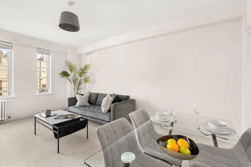 Dolphin House and Dolphin Square Apartments, Pimlico: Living room with glass dining table and fruit bowl