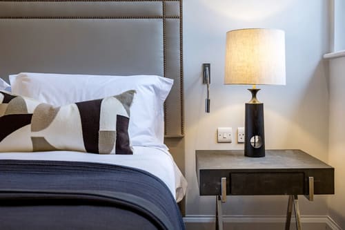 The Knightsbridge Apartments, Knightsbridge: Bedside table with black lamp
