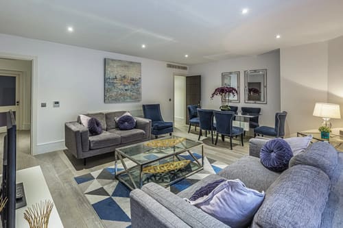 Green Street Residences, Mayfair: Living room with grey sofa and glass coffee table
