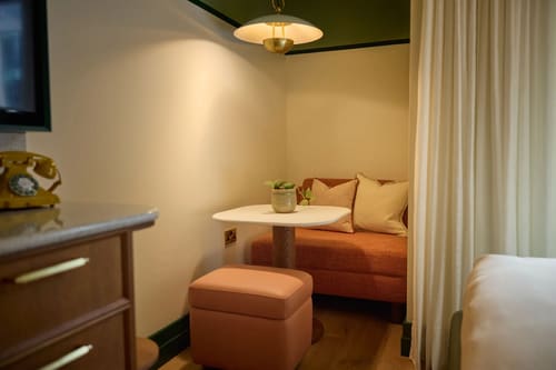 The July Apartments, Victoria: Coral sofa nook with small table