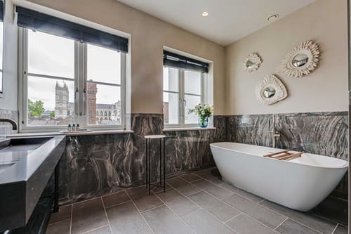 The Westminster Residences, Westminster: Bathroom with freestanding tub and marble walls