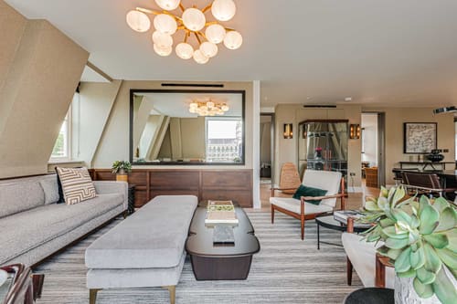 The Westminster Residences, Westminster: Living room with globe chandelier and grey ottoman