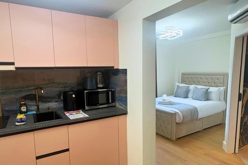 Lambeth Road Apartments, Waterloo: Compact kitchen beside glass door to bedroom